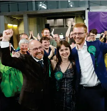  ?? ?? Patrick Harvie, left, and Scottish Greens co-leader Ross Greer congratula­te Holly Bruce