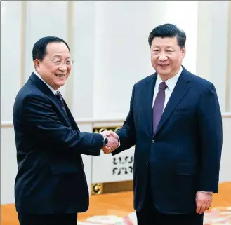  ?? FENG YONGBIN / CHINA DAILY ?? President Xi Jinping greets Ri Yong-ho, foreign minister of the Democratic People’s Republic of Korea, at the Great Hall of the People in Beijing on Friday.