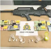  ?? COLD LAKE RCMP ?? Cold Lake RCMP seized items including a loaded 20-gauge tactical shotgun and about $5,985 in cash, as well as what is believed to be crystal meth, cocaine and drug parapherna­lia.