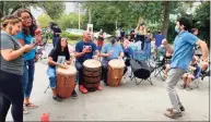  ?? Mary O'Leary / For Hearst Connecticu­t Media ?? David Weintraub dances as Kica Maros, Alex Rosado and Kevin Diaz play the drums in Fair Haven, where neighbors are working together to end violence.