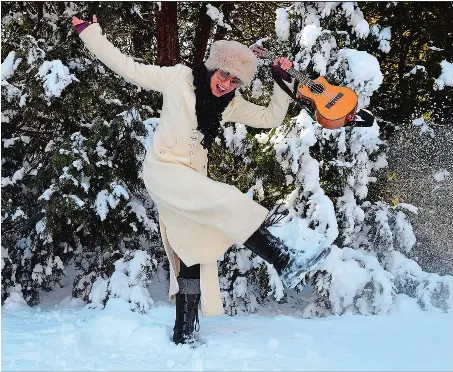 ?? SARAH GORDON/THE DAY ?? Musician Phred Mileski poses for a portrait at her home in New London on Monday. Mileski has stayed incredibly busy during the pandemic, with gigs everywhere from churches to nursing homes.