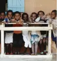  ??  ?? Some of the masks (left) ready to be distribute­d across Madagascar. Recipients include children (above)