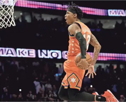  ?? NAM Y. HUH/AP ?? Team USA guard Ja Morant of the Memphis Grizzlies goes up for a dunk against Team World during the NBA Rising Stars game in Chicago on Friday.