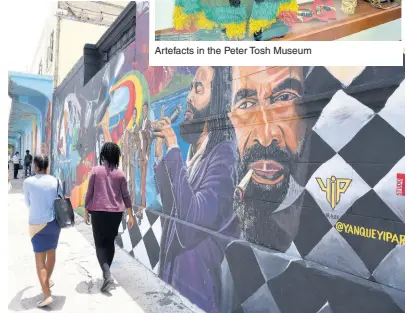  ?? PHOTO BY IAN ALLEN ?? Murals on wall along Church Street in downtown Kingston spruce up the space.