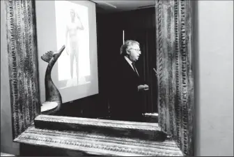  ?? ?? Gian Mario Spacca, then president of the Italian region of Marche, is seen reflected in a mirror while being interviewe­d after speaking about the ongoing dispute with J. Paul Getty Museum relating to the statue “Victorious Youth,” also known as “Atleta di Fano” in Los Angeles, March 28, 2011. (Reuters photo)