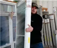  ?? (The Sentinel-Record/Lance Brownfield) ?? WinChoice USA donates $40,000 in merchandis­e to Garland County Habitat for Humanity to round out the year.