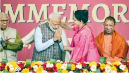  ?? — PTI ?? Prime Minister Narendra Modi is greeted by local BJP MP and actress Hema Malini during a programme to mark the serving of the 3rd billionth meal by the Akshaya Patra Foundation in Vrindavan on Monday.