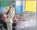  ?? HT FILE PHOTO ?? A school employee sanitises a classroom.