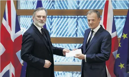  ?? PHOTO: REUTERS ?? Triggered . . . Britain’s permanent representa­tive to the European Union Tim Barrow (left) delivers British Prime Minister Theresa May’s Brexit letter in notice of the UK’s intention to leave the bloc, under Article 50 of the EU’s Lisbon Treaty, to EU...
