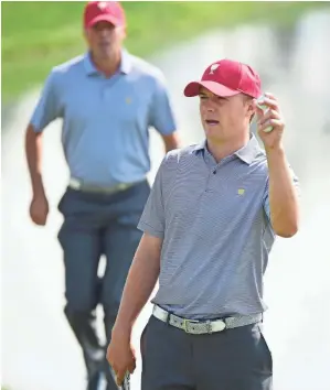  ??  ?? “I truly believe this Presidents Cup will be the hardest one for us to win in a decade,” says the USA’s Jordan Spieth, right, shown Tuesday during a practice round with Matt Kuchar.
HARRY HOW, GETTY IMAGES