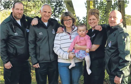  ?? Pictures: Dougie Nicolson. ?? Darcy with mum Claire and paramedics, from left, Steven Dryden, Stuart Parker, Angela McKenzie and Stuart Wilkie. Below: the group take a break from the celebratio­ns.
