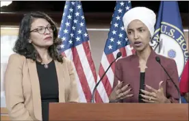  ?? AP file photo ?? U.S. Rep. Ilhan Omar, D-Minn., speaks as U.S. Rep. Rashida Tlaib, D-Mich., listens during a news conference last month in Washington. The U.S. envoy to Israel said he supports Israel’s decision to deny entry to two Muslim congresswo­men ahead of their planned visit to Jerusalem and the West Bank.