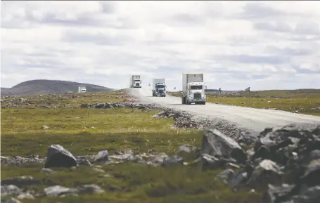  ?? COLE BURSTON/BLOOMBERG FILES ?? Trucks drive along a road near Agnico’s Meadowbank gold complex in Nunavut in July. Agnico CEO Sean Boyd says Canada needs a better conversati­on about how its resources can be tapped to create value for everyone.