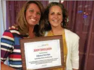  ??  ?? Teacher and South High Marathon Dance co-advisor Jody Sheldon, left, is South Glens Falls Rotary Club’s Citizen of the Year. Past club President Jaime Thompson, right, presented the award.