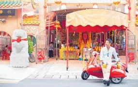  ??  ?? Singapore Side Cars founder Simon Wong with one of his vintage Vespas.