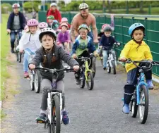  ??  ?? Children cycling the 2km trail at IT Sligo.