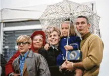  ?? Courtesy Amy Bean ?? Gene Cernan holds Amy Bean, 6, and joins Sue Bean, center, Sue’s mother Floy Mae Ragsdale and the Beans’ son, 12-year-old Clay.