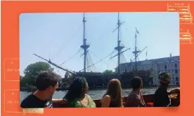  ?? Amsterdam’s Oosterdok. Composite: Alamy/Jennifer Tosch ?? A tour group passes a replica of a colonial Dutch East India Company ship moored in