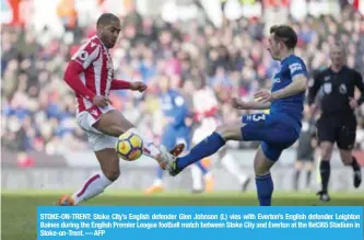  ??  ?? STOKE-ON-TRENT: Stoke City’s English defender Glen Johnson (L) vies with Everton’s English defender Leighton Baines during the English Premier League football match between Stoke City and Everton at the Bet365 Stadium in Stoke-on-Trent. — AFP