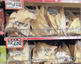  ?? Louis Sahagun Los Angeles Times ?? DRIED SHARK FINS on sale in L.A.’s Chinatown for nearly $600 a pound in 2013, before a California ban on buying, selling and possessing them took effect.