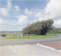  ??  ?? The roundabout at Delta Lakes, on the B4304 in Llanelli where Justin Hill, from Waunarlwyd­d, was knocked off his bike and ‘left for dead’.