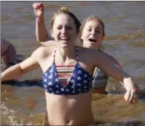  ?? FRAN MAYE — MEDIANEWS GROUP ?? Facial expression­s tell the story of how cold the water was Saturday morning during the 11th annual Polar Plunge.