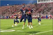  ??  ?? Piqua’s BradyUohl (7) and Bryson Roberts celebrate a 2610 victory over rival Troy on opening night Friday.