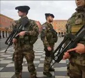  ??  ?? Les militaires de l’opération Sentinelle patrouille­nt sur l’ensemble du territoire national comme ici sur la place Masséna. (Photo Frantz Bouton)