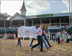  ?? BARBARA D. LIVINGSTON ?? Justify is paraded in front of the fans at Churchill Downs days after becoming the 13th Triple Crown winner.