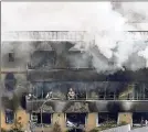  ?? KYODO NEWS VIA AP ?? Firefighte­rs work as smoke billows from the threestory Kyoto Animation building Thursday in western Japan.