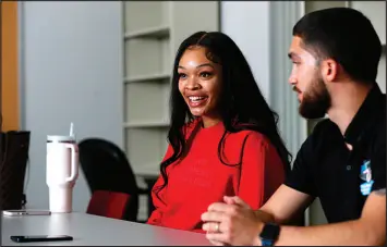  ?? STEVE MARCUS ?? D’ahna Scott, left, and Solomon Escalante talk about working as interns with the Las Vegas Super Bowl Host Committee during an interview Jan. 31 at UNLV.