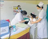  ?? AFP ?? A nurse receives a Covid-19 vaccine at Osmania General Hospital in Hyderabad on Monday.