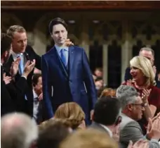  ?? SEAN KILPATRICK/THE CANADIAN PRESS ?? Tory MP Chris Warkentin holds a cardboard PM in the House of Commons.