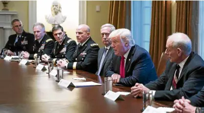  ?? —AFP ?? US President Donald Trump, flanked by Defense Secretary James Mattis (left) and chief of staff John Kelly, meets with senior military leaders at the White House on Oct. 5.