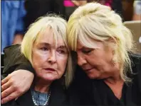  ??  ?? Comforted: June Steenkamp, left, yesterday