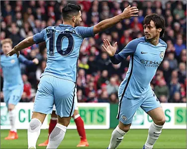  ??  ?? SILVA LINING: Aguero hails the Spaniard for scoring opener