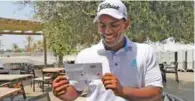  ?? – Supplied photo ?? FLAWLESS ROUND: Rayhan Thomas displays his card after a world record-equalling nine birdies in a row in the second round of Dubai Creek Open on Tuesday.