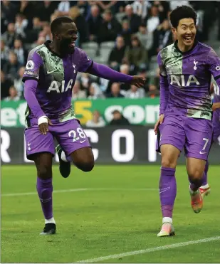  ?? ?? Son Heung-min wheels away in celebratio­n after scoring Spurs’ third goal of the afternoon at Newcastle