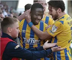  ?? ?? OH DANNY JOY Match-winner Udoh celebrates with his team-mates and fans