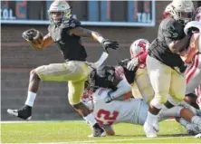  ?? STAFF PHOTO BY ERIN O. SMITH ?? Notre Dame’s Cameron Wynn, carrying the ball above against Baylor on Aug. 17, is the Waffle House All-Star player of the week.