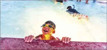  ?? PHOTO VINCENT OSUNA ?? Alyas Chavez, 7, of Calipatria, comes up for a breath of fresh air during Autism Support of Imperial County’s summer pool party on Saturday at the Imperial City Pool in Imperial.