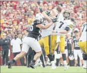  ?? DAVID PURDY — GETTY IMAGES ?? Iowa quarterbac­k Spencer Petras (7), a former Marin Catholic standout, throws a pass under pressure from Iowa State defensive end Zach Petersen in the first half of play at Jack Trice Stadium on Saturday in Ames, Iowa.