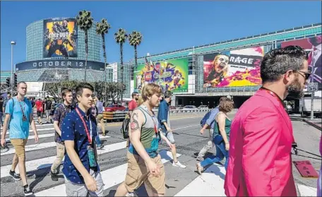  ?? Irfan Khan Los Angeles Times ?? VR STILL has pitfalls. For instance, playing VR games for extended periods is nausea-inducing for many users. Above, E3 attendees.