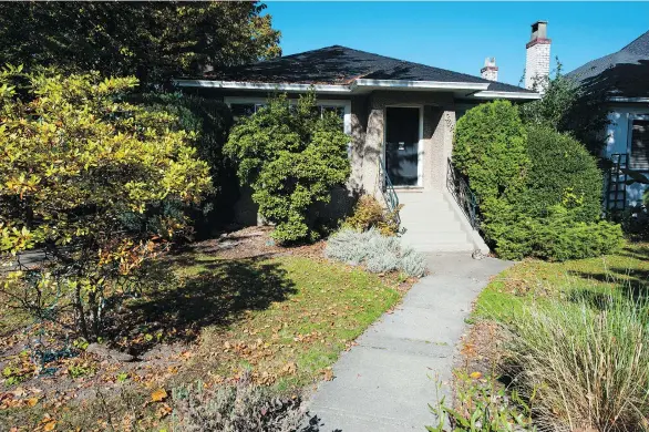  ?? FRANCIS GEORGIAN ?? Kris Klaasen has owned his corner house in Kitsilano since 1982, when he bought it for $126,000. Today it could fetch more than $2.4 million, he’s been told.