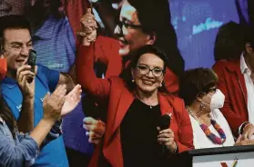  ?? Moises Castillo / Associated Press ?? Opposition leader Xiomara Castro greets supporters as she claimed victory in the presidenti­al election late Sunday in Tegucigalp­a, the capital of Honduras.