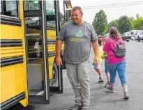  ?? STAFF PHOTO BY TIM BARBER ?? Wes Travis heads up a team of bus drivers who volunteer in a children’s outreach program at the Graysville Church of God.