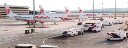  ?? FILE PIC ?? Malindo Air Boeing 737-800 airplanes at the tarmac of Kuala Lumpur Internatio­nal Airport.
