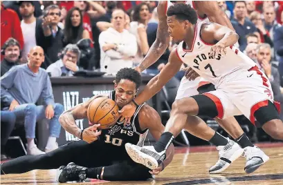  ?? RICHARD LAUTENS TORONTO STAR ?? Kyle Lowry’s pressure of DeMar DeRozan created a turnover that allowed the Raptors to take the lead in the final 20 seconds.