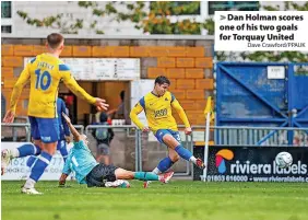  ?? Dave Crawford/PPAUK ?? > Dan Holman scores one of his two goals for Torquay United