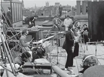  ?? GETTY IMAGES ?? The Beatles perform their last live public concert on the rooftop of the Apple Organisati­on building for director Michael Lindsey-Hogg’s film documentar­y, Let It Be. Many sound tapes, including those from the session, disappeare­d and were only retrieved with the help of Interpol, says New Zealand film-maker Sir Peter Jackson.